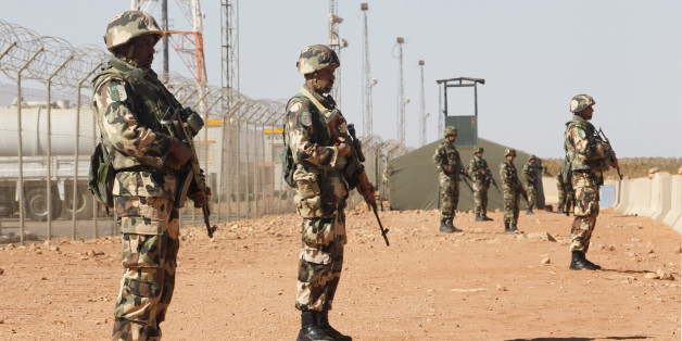 Algerian soldiers are seen at the Tiguentourine Gas Plant in In Amenas, 1600 km (994 miles) southeast of Algiers, January 31, 2013. REUTERS/Louafi Larbi (ALGERIA - Tags: MILITARY POLITICS CRIME LAW)