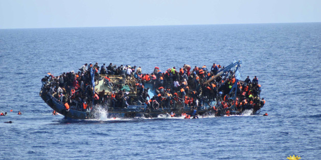 Migrants are seen on a capsizing boat before a rescue operation by Italian navy ships "Bettica" and "Bergamini" (unseen) off the coast of Libya in this handout picture released by the Italian Marina Militare on May 25, 2016. Marina Militare/Handout via REUTERS/File Photo ATTENTION EDITORS - THIS PICTURE WAS PROVIDED BY A THIRD PARTY. FOR EDITORIAL USE ONLY.