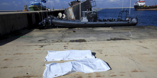 Bags containing a body of two migrants, who died after a boat sank off the coast, lay in a navy base in Tripoli, Libya, December 21, 2015. REUTERS/Ismail Zitouny