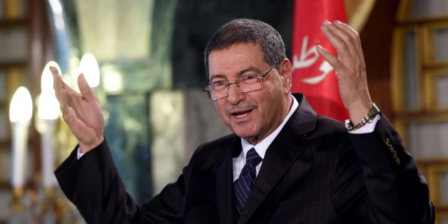 Tunisia's nominated Prime Minister Habib Essid announces a new cabinet ministers list after presenting the list to the Tunisia's President Beji Caid Essebsi during a press conference at Carthage Palace in Tunis on January 23, 2015. Essid presented a government representing what he said were 'national skills', excluding the Islamist Ennahda party from the list, however he must obtain the confidence of the Parliament before they take office. AFP PHOTO / FETHI BELAID
(Photo credit should read FETHI BELAID/AFP/Getty Images)