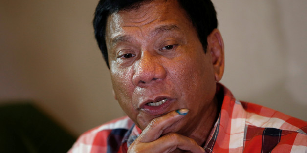 Presidential candidate Rodrigo "Digong" Duterte talks to reporters in Davao city in southern Philippines, May 9, 2016. REUTERS/Erik De Castro