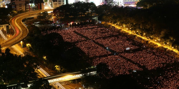 Thousands of people take park in a candlelight vigil to mark the 27th anniversary of the crackdown of pro-democracy movement at Beijing's Tiananmen Square in 1989, at Victoria Park in Hong Kong June 4, 2016. REUTERS/Paul Yeung