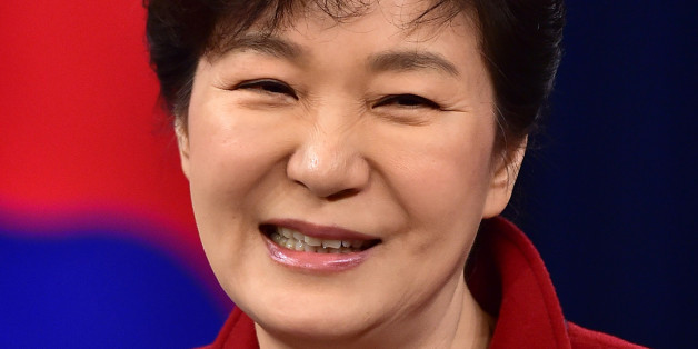 South Korean President Park Geun-hye smiles during her New Year's press conference at the presidential Blue House in Seoul Monday, Jan. 12, 2015. (AP Photo/Jung Yeon-je, Pool)