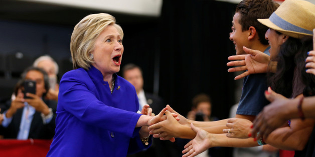 U.S. Democratic presidential candidate Hillary Clinton greet supporters as she arrives at a campaign stop in Long Beach, California, United States June 6, 2016. REUTERS/Mike Blake