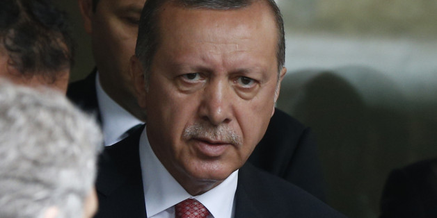 Turkey's President Recep Tayyip Erdogan walks outside a hospital after visiting wounded people, near an explosion site in Istanbul, Tuesday, June 7, 2016. A car bomb attack targeting a bus carrying riot police during rush hour traffic in Istanbul on Tuesday has killed number of people and wounded dozens others, the city's governor said. (AP Photo/Lefteris Pitarakis)