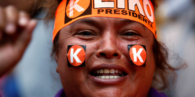 A woman wears a headband with the name of Peruvian presidential candidate Keiko Fujimori in Lima, Peru, June 5, 2016. REUTERS/Janine Costa