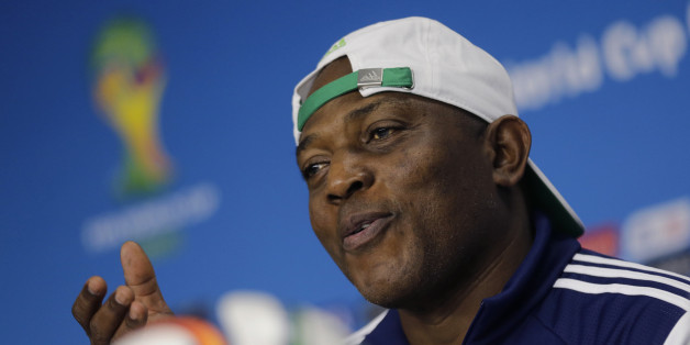Nigeria's national soccer team coach Stephen Keshi speaks to journalists during a news conference after a training session at the Arena Baixada soccer stadium in Curitiba, June 15, 2014. The stadium will host the first of four 2014 World Cup matches on June 16. REUTERS/Henry Romero (BRAZIL - Tags: SPORT SOCCER WORLD CUP)