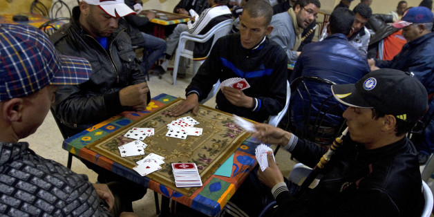 Locals youths play cards at a coffee shop, in the town of Sidi Bouzid,Tunisia, Tuesday March 8, 2011. Sidi Bouzid, is the hometown of Mohamed Bouazizi, the local fruit vendor and high-school dropout who set himself on fire Dec. 17, in a desperate act that set off mass protests that brought down Tunisian President Zine El Abidine Ben Ali in less than a month. The revolt inspired others who toppled autocratic Egyptian President Hosni Mubarak, launched an armed rebellion against Libyan despot Moamm