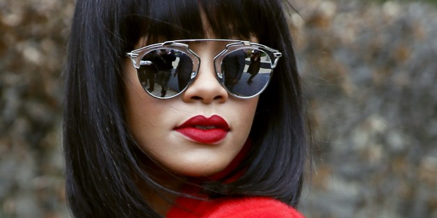 Barbadian singer Rihanna poses as she arrives to attend Christian Dior 2014/2015 Autumn/Winter ready-to-wear collection fashion show, on February 28, 2014 in Paris. AFP PHOTO/PATRICK KOVARIK (Photo credit should read PATRICK KOVARIK/AFP/Getty Images)