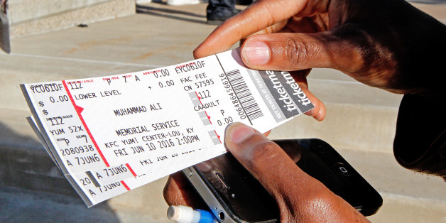Fay Brents looks over her four tickets to Muhammad Ali's Friday memorial service at the KFC Yum! Center in Louisville, Kentucky, U.S. June 8, 2016. REUTERS/John Sommers II