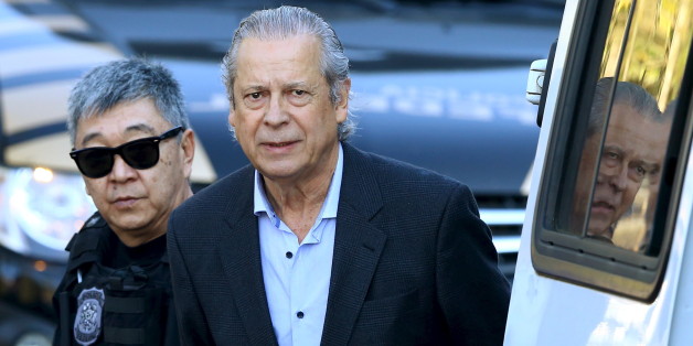 Jose Dirceu (R), former Brazilian President Luiz Inacio Lula da Silva's chief of staff, is escorted by federal police officer Newton Ishii as he leaves the Federal Police headquarters to give his testimony in a session of the Parliamentary Committee of Inquiry in Curitiba, Brazil, August 31, 2015. Brazilian police on August 3 arrested former government minister Dirceu, one of the most senior members of the ruling Workers' Party to be detained so far in the corruption scandal engulfing state-run