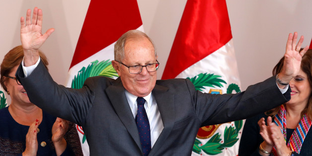 Peruvian presidential candidate Pedro Pablo Kuczynski, greets the press after Peru's electoral office ONPE said that he won more votes than Keiko Fujimori in the country's cliffhanger presidential election in his headquarters in Lima, Peru, June 9, 2016. REUTERS/Janine Costa