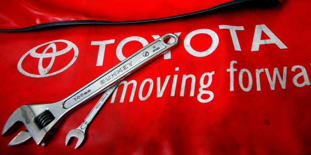 Spanners are placed on a mat by mechanics for the photographer inside a Toyota service centre in Taipei March 3, 2010. REUTERS/Nicky Loh/File Photo