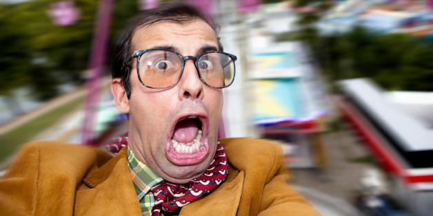 Happy man doing a selfie at carousel