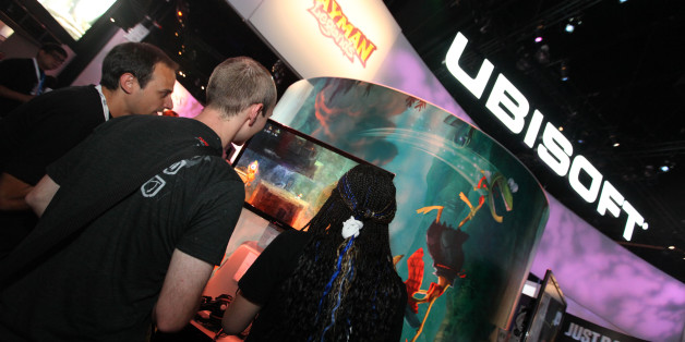 Guests play Rayman Legends at the Ubisoft booth on Thursday, June 7, 2012 at E3 in Los Angeles. (Photo by Casey Rodgers/Invision for Ubisoft)