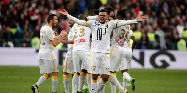 Lille's Sofiane Boufal, center, celebrates after team mate Djibril Sidibe scored a goal, during the League Cup final soccer match between Paris Saint Germain and Lille, at the Stade de France stadium, in Saint Denis, north of Paris, Saturday, April 23, 2016. (AP Photo/Thibault Camus)