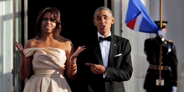 U.S. President Barack Obama and First Lady Michelle Obama react while waiting for the arrival of the Iceland Prime Minister Sigurdur Ingi Johannsson and his wife at a state dinner in the White House during the U.S.-Nordic Leaders Summit in Washington, U.S. May 13, 2016. REUTERS/Carlos Barria