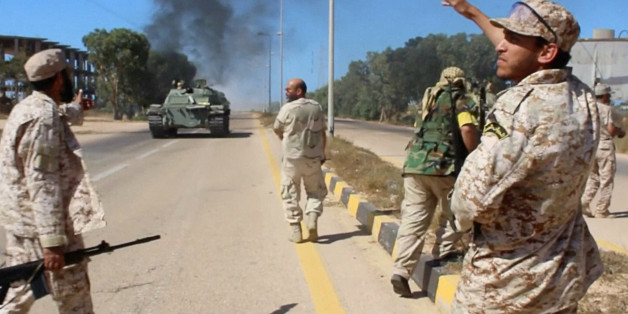 Soldiers from a force aligned with Libya's new unity government walk along a road during an advance on the eastern and southern outskirts of the Islamic State stronghold of Sirte, in this still image taken from video on June 9, 2016. via Reuters TV TPX IMAGES OF THE DAY