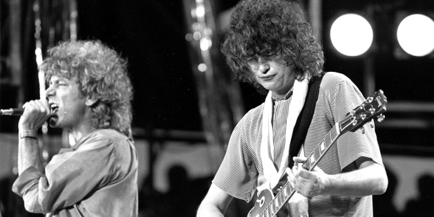** FILE ** Singer Robert Plant, left, and guitarist Jimmy Page, right, of the British rock band Led Zeppelin perform at the Live Aid concert at Philadelphia's J.F.K. Stadium in this file photo July 13, 1985. Led Zeppelin, one of the last major acts to resist digital distribution, are releasing their back catalog online. Songs including "Communication Breakdown," "Whole Lotta Love" and "Stairway to Heaven," will be available from online music stores Nov. 13. The band is due to release a two-CD retrospective, "Mothership," the same day. (AP Photo/Rusty Kennedy)