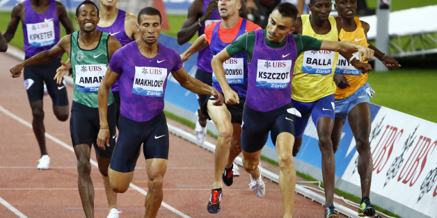 Adam Kszczot of Poland and Taoufik Makhloufi of Algeria cross the finish line in the men's 800m event at the IAAF Athletics Diamond League meeting in Zurich September 3, 2015. REUTERS/Ruben Sprich