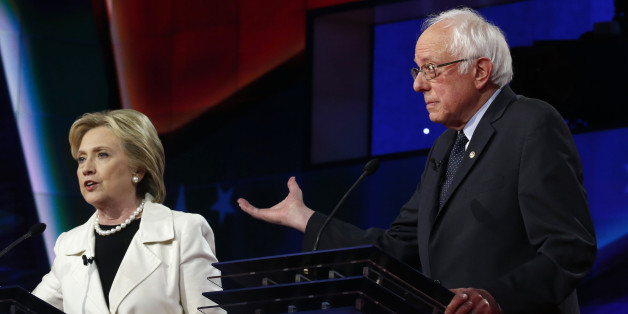 Democratic U.S. presidential candidate Hillary Clinton (L) speaks as rival candidate Senator Bernie Sanders gestures during a Democratic debate hosted by CNN and New York One at the Brooklyn Navy Yard in New York April 14, 2016. REUTERS/Lucas Jackson