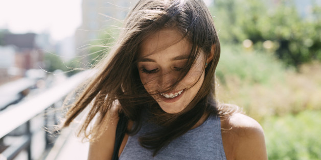 USA, New York City, smiling brunette young woman outdoors