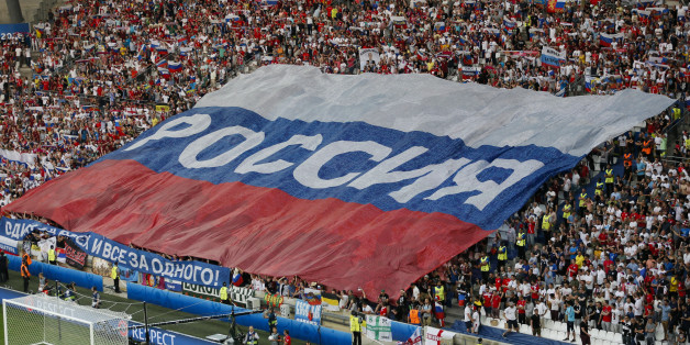 Football Soccer - England v Russia - EURO 2016 - Group B - Stade Velodrome, Marseille, France - 11/6/16 - Russian team supporters stretch giant Russian flag in the stands. REUTERS/Robert Pratta