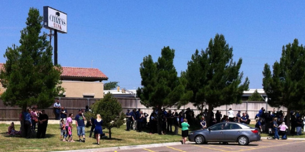 This photo provided by ABC7 KVII shows the scene where police say officers are responding to a "reported shooting" at a Walmart in Amarillo, Texas on Tuesday, June 14, 2016. (ABC7 KVII via AP)