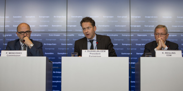 Jeroen Dijsselbloem, center, Dutch finance minister and head of the group of euro-area finance ministers, center, speaks as Pierre Moscovici, left, economic commissioner for the European Union (EU), and Klaus Regling, managing director of the European Stability Mechanism (ESM) and chief executive officer of the European Financial Stability Facility (EFSF), listen during a press conference after roundtable talks during a Eurogroup meeting in Luxembourg on Monday, Oct. 5, 2015. Euro-area finance ministers warned Greek Prime Minister Alexis Tsipras he must not ease up on the work of overhauling his countrys economy if theyre to approve the debt-crippled nation's next bailout payment. Photographer: Jasper Juinen/Bloomberg via Getty Images