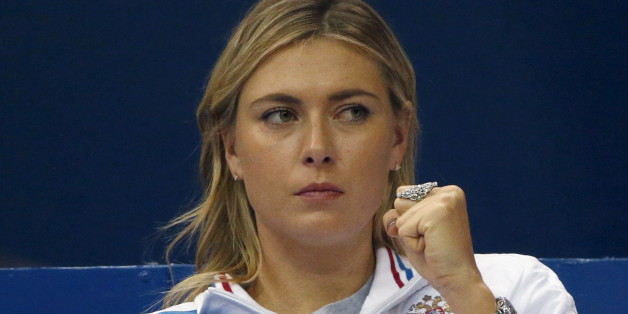 Russia's Maria Sharapova reacts as she watches compatriot Ekaterina Makarova play against Kiki Bertens of the Netherlands during their Fed Cup World Group tennis match in Moscow, February 6, 2016. REUTERS/Grigory Dukor
