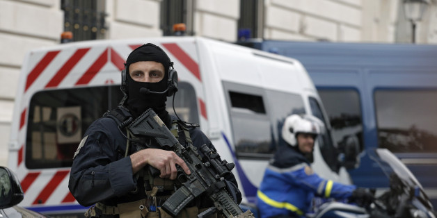 Members of French military task force GIGN secure the convoy transporting Paris attacks suspect, Salah Abdeslam as they leave the Paris courthouse, Friday, May 20, 2016. The last known survivor of the team that carried out last November's Paris attacks refused to talk during questioning Friday by anti-terror judges, and the session ended abruptly. (AP Photo/Laurent Cipriani)