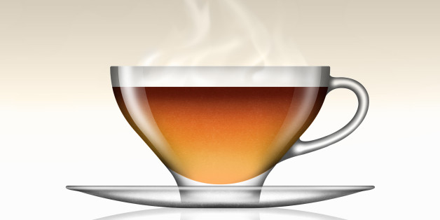 Earl Grey tea in glass teacup and saucer