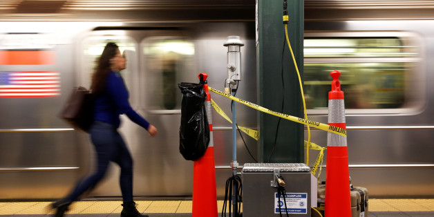 A woman walks by a device used for chemical tracers used by the Department of Homeland Security and New York Metropolitan Transportation Authority during a test of how gas would flow through the subway system in New York, U.S., May 9, 2016. REUTERS/Shannon Stapleton