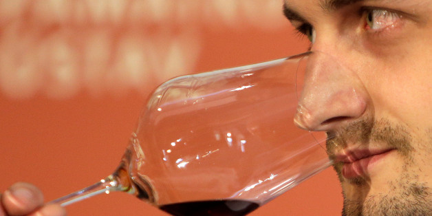 A sommelier smells a glass of 19th-century wine in Becov castle in Becov nad Teplou, Czech Republic, May 22 2016. REUTERS/David W Cerny