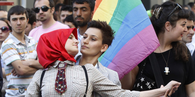 Participants dance during a gay pride parade in central Istanbul June 26, 2011. REUTERS/Murad Sezer (TURKEY - Tags: SOCIETY)
