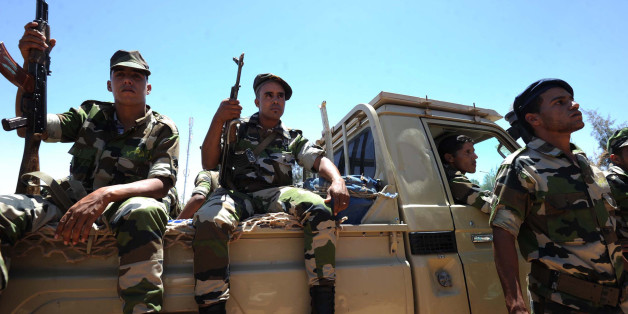Members of the Sahrawi People's Liberation Army stand guard during the funeral of Mohamed Abdelaziz, the leader of the Western Sahara's Polisario Front, in the Algerian city of Tindouf, on June 3, 2016.
The leader of the Western Sahara's Polisario Front, who died on Tuesday, will be buried on Saturday in a Polisario-controlled part of the former Spanish colony, an official told AFP. / AFP / Farouk Batiche (Photo credit should read FAROUK BATICHE/AFP/Getty Images)