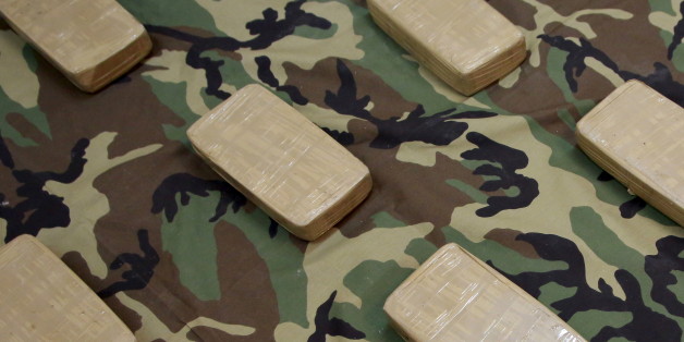 Confiscated packets of cocaine are displayed at the Bolivian anti-drugs police force (FELCN) headquarters in La Paz, Bolivia, March 28, 2016. REUTERS/David Mercado