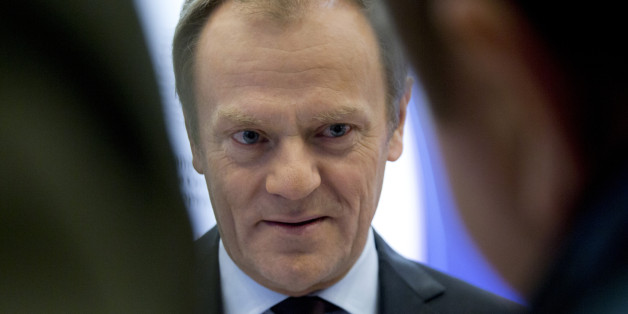 European Council President Donald Tusk speaks with journalists as he arrives at the European Council building in Brussels on Wednesday, Feb. 17, 2016. European Union leaders will hold a summit in Brussels on Thursday and Friday to hammer out a deal designed to keep Britain in the 28-nation bloc. (AP Photo/Virginia Mayo)