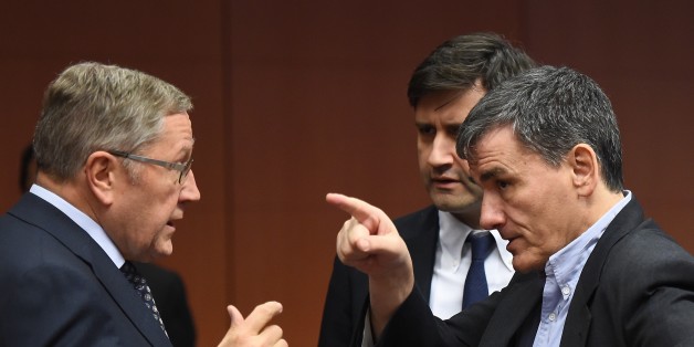 (L-R) Managing Director of the European Stability Mechanism Klaus Regling, Greek Alternate Minister of Finance George Chouliarakis and Greece's Finance Minister Euclid Tsakalotos speak during an Eurogroup finance ministers' meeting at the European Council in Brussels, January 14, 2016. / AFP / EMMANUEL DUNAND (Photo credit should read EMMANUEL DUNAND/AFP/Getty Images)