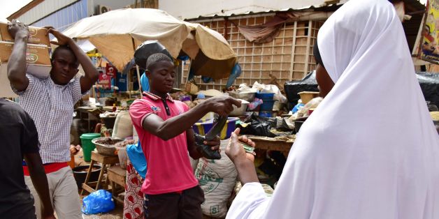 A muslim woman purchases goods for the Ramadan holiday at a market in Niamey on June 12, 2016.
The month-long Ramadan holiday is spent by Muslims fasting during the daylight hours from dawn to sunset. / AFP / ISSOUF SANOGO (Photo credit should read ISSOUF SANOGO/AFP/Getty Images)