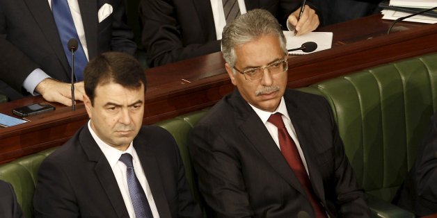 Tunisian's newly-appointed Tunisian Foreign Minister Khemaies Jhinaoui (L), Justice Minister Amor Mansour (R) and Interior Minister Hedi Majdoub (C) attend a plenary session at the Assembly of People's Representatives in Tunis, Tunisia January 11, 2016. REUTERS/Zoubeir Souissi
