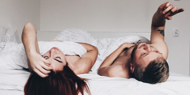 beautiful couple lying together on the bed