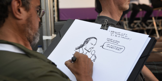 A man sketches a portrait of the leader of left wing party Podemos and party candidate for the upcoming general elections, Pablo Iglesias during a campaign meeting in Vitoria on June 21, 2016.
Spain is holding its second elections in six months, on June 26, after being governed by a caretaker government with limited powers since the December 20 polls put an end to the country's traditional two-party system as voters fed up with austerity and corruption scandals flocked to new groups. / AFP / ANDER GILLENEA (Photo credit should read ANDER GILLENEA/AFP/Getty Images)