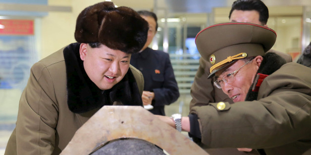 FILE PHOTO: North Korean leader Kim Jong Un looks at a rocket warhead tip after a simulated test of atmospheric re-entry of a ballistic missile, at an unidentified location in this undated photo released by North Korea's Korean Central News Agency (KCNA) in Pyongyang on March 15, 2016. KCNA/File Photo via REUTERS ATTENTION EDITORS - THIS IMAGE WAS PROVIDED BY A THIRD PARTY. EDITORIAL USE ONLY. REUTERS IS UNABLE TO INDEPENDENTLY VERIFY THIS IMAGE. NO THIRD PARTY SALES. SOUTH KOREA OUT. NO COM
