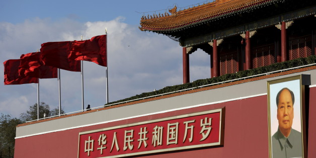 A giant portrait of Chinese late chairman Mao Zedong is seen on the Tiananmen gate on a sunny day December 2, 2015, after a fresh cold front cleared the smog that was blanketing Beijing, China. REUTERS/Damir Sagolj