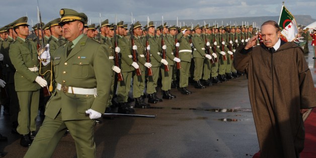 President Abdelaziz Bouteflika reviews an honor guard upon his arrival at Oran airport on December 16, 2008.