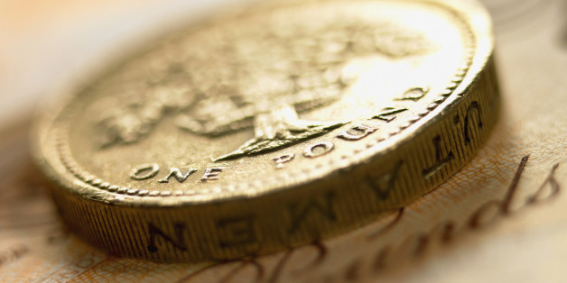 Close up of British pound coin and currency