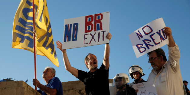 Anti-government demonstrators hold placards reading "No Brexit" during a protest outside the parliament in Athens, Greece June 15, 2016. REUTERS/Alkis Konstantinidis