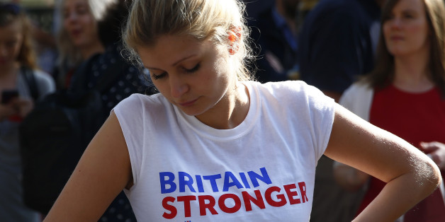 A woman wearing a vote remain tee-shirt reacts, following the result of the EU referendum, in London, Britain June 24, 2016. REUTERS/Neil Hall