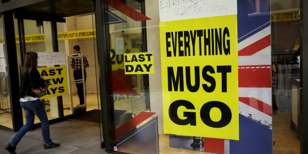 A store closing sale banner stating "Everything Must Go" on a window next to the colors of the Union flag in the City of London, Friday, June 24, 2016. Britain's Prime Minister David Cameron announced Friday that he will quit as Prime Minister following a defeat in the referendum which ended with a vote for Britain to leave the European Union. (AP Photo/Matt Dunham)